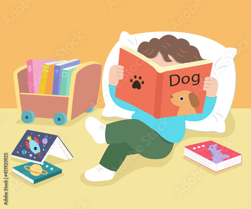 The boy leaned on the pillow and read a book. There was a small bookcase and books next to it.