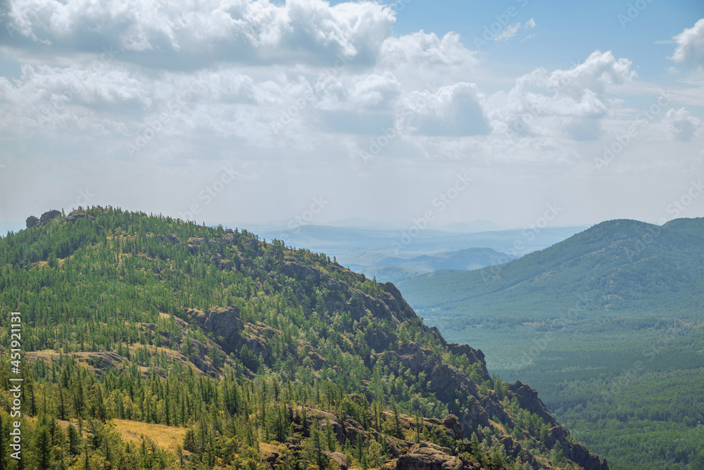 Naklejka premium beautiful landscape, mountains and hills against the sky. panorama of the forest view from the mountain