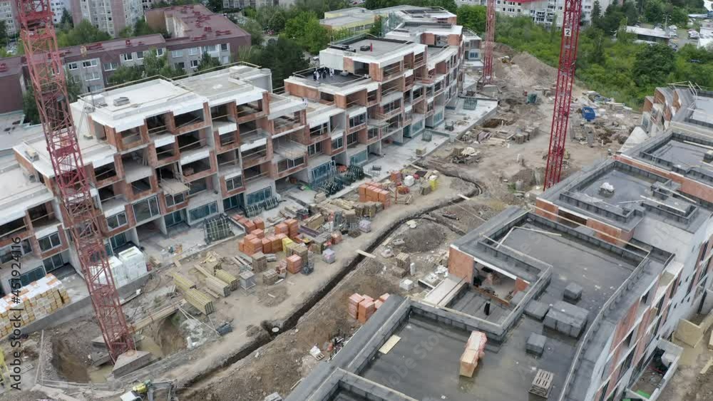 Construction of new luxury apartments in a residential area,cranes. Construction of new luxury apartments in a residential area,cranes.