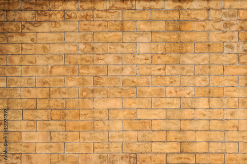 Brick wall with wet stain. Design of wall brickwork in traditional stretcher bond.