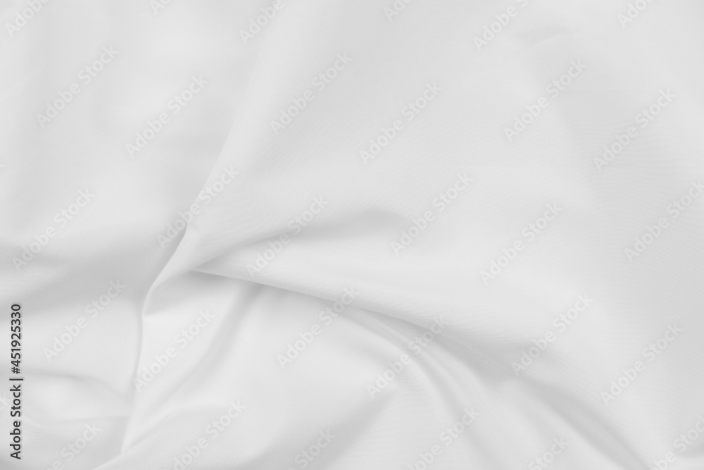 Abstract white fabric texture background. Cloth soft wave. Creases of satin, silk, and cotton.