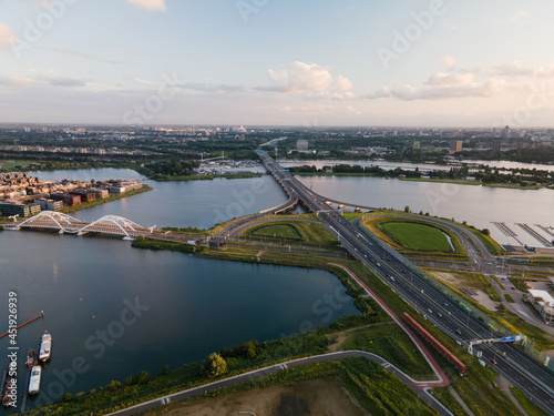 Aerial view of a highway crossing intersection A10 S114 in Amsterdam with traffic going over.
