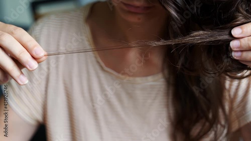 Young woman has hair loss problem. Loosing hair after covid disease. Care shampoo for repairing thin hair. Avitaminosis, anaemia problem 