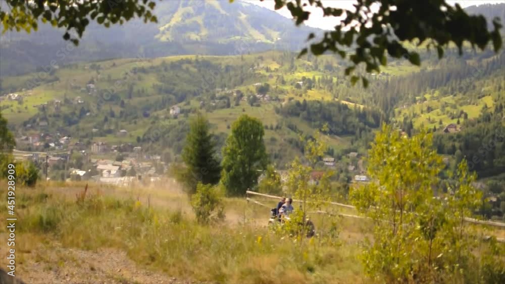 Group of people on ATVs are driving in the Carpathian Mountains