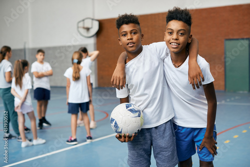 Fototapeta Naklejka Na Ścianę i Meble -  Happy African American boys have physical education class at school gym.