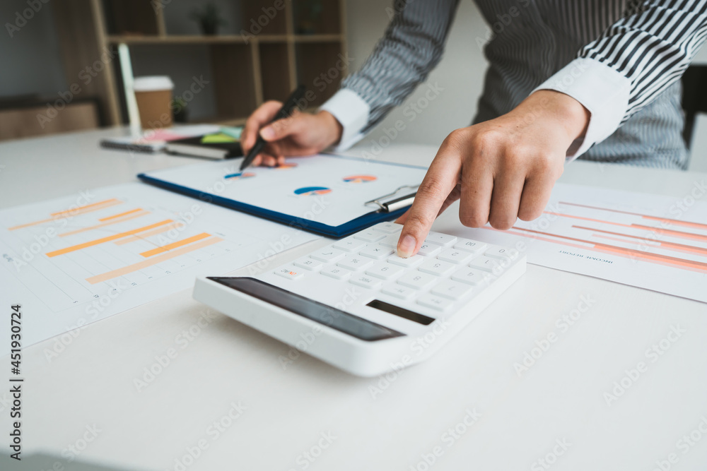 Business people or accountants are analyzing graphs on finance, investment, graph chart business strategy ideas, data analysis technology. Business people or accountants are analyzing graphs on finance, investment, graph chart business strategy ideas, data analysis technology.