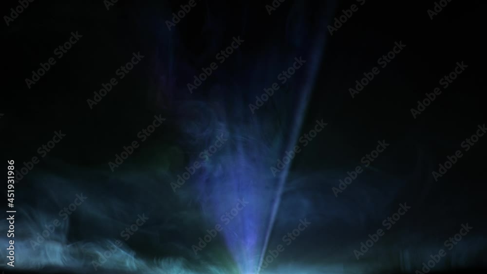 Video projector beam shining through smoke with jib moves