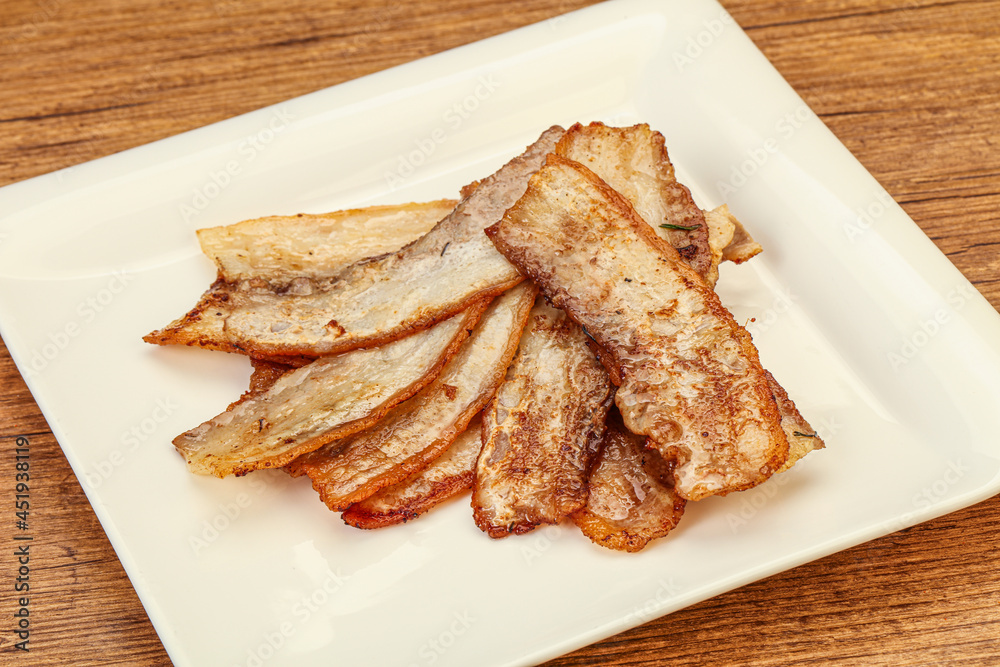 Roasted juicy bacon in the plate Roasted juicy bacon in the plate