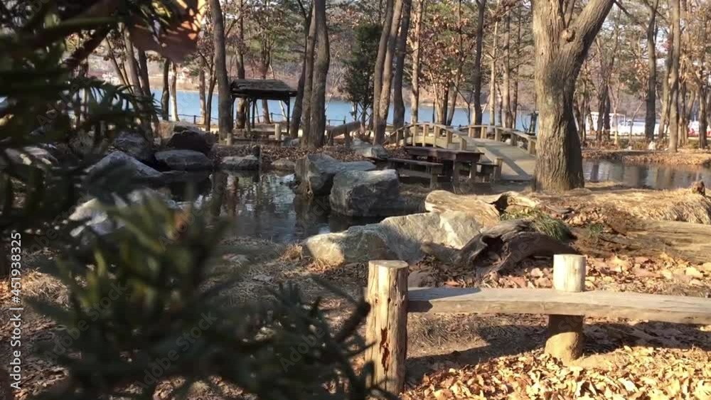 Big Wooden Bridge under a Frozen Pond with falls and big rocks Big Wooden Bridge under a Frozen Pond with falls and big rocks