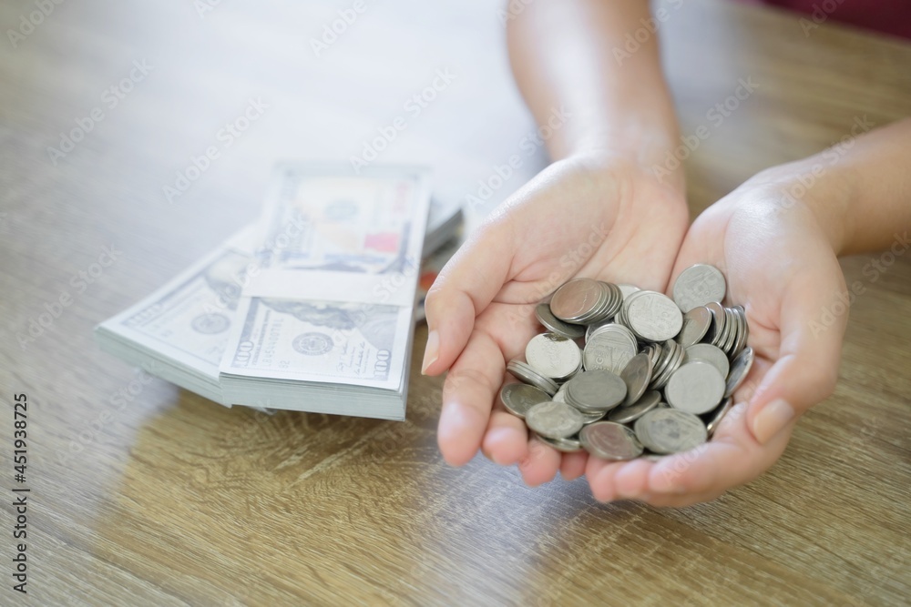 Woman hand money and giveing donate charity.raise donation concept Woman hand money and giveing donate charity.raise donation concept