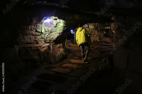 cave tourist, travel adventure landscape man in a hole