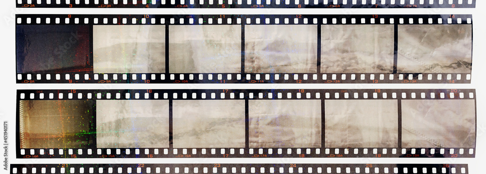 35mm positive filmstrips with empty frames, real scan of film material with cool scanning light interferences on the material. retro photo placeholder.