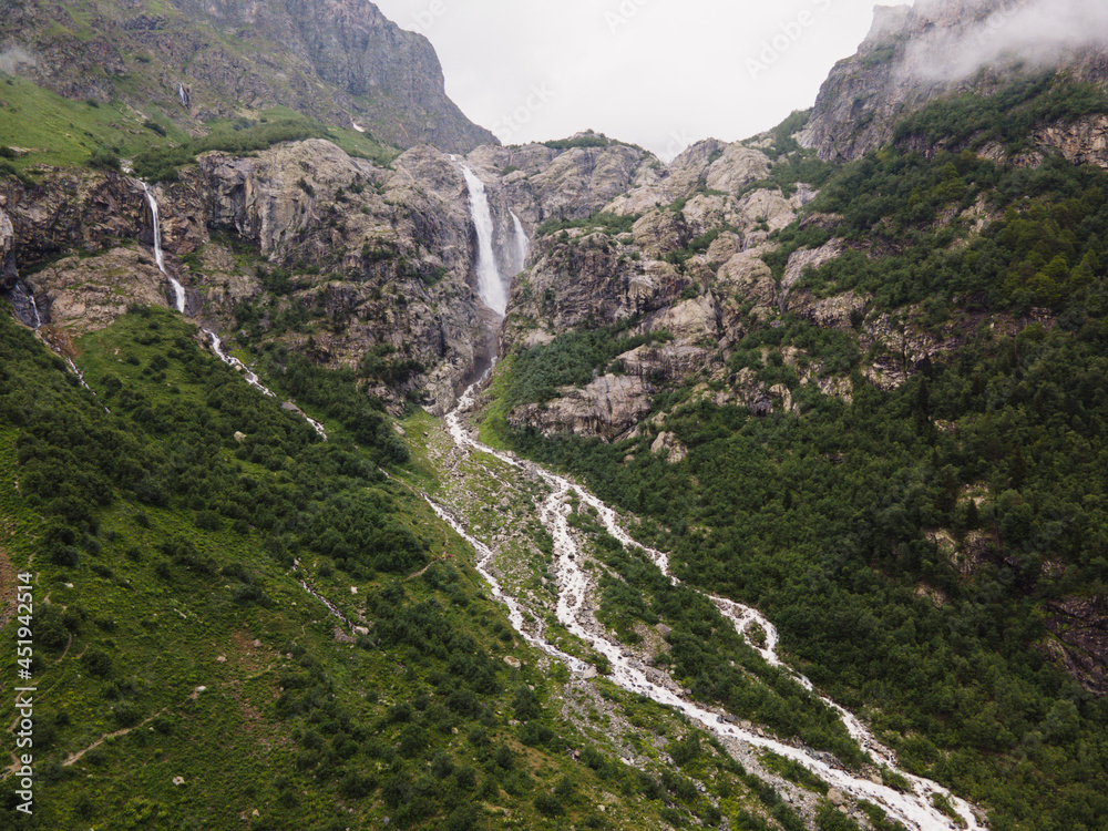 Georgia waterfall in the mountains blue sky aerial drone photo.jpg Georgia waterfall in the mountains blue sky aerial drone photo.jpg