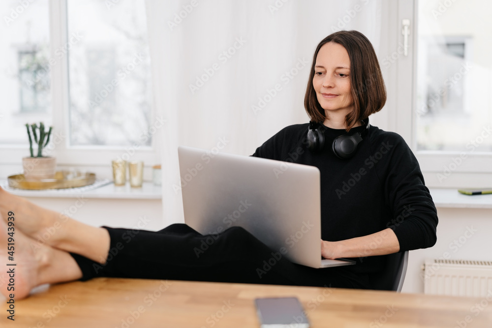 Laid back woman relaxing with feet up Laid back woman relaxing with feet up