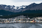 USHUAIA, ARGENTINA - april 04. 2018: Ships at the Port of Ushuaia, the capital of Tierra del Fuego, next to the little harbor town. Ushuaia is the southernmost city in the world