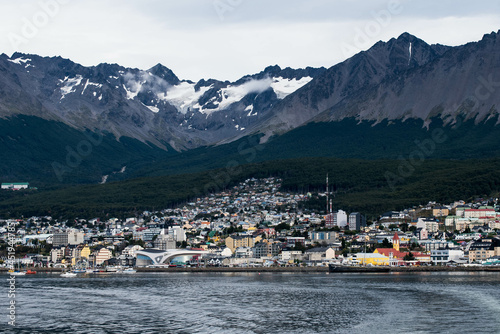 USHUAIA, ARGENTINA - april 04. 2018: Ships at the Port of Ushuaia, the capital of Tierra del Fuego, next to the little harbor town. Ushuaia is the southernmost city in the world © Martina