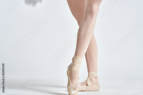 ballerina's legs in ballet flats flexibility performance exercises