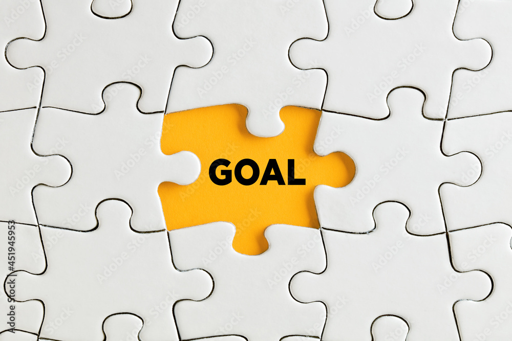 The word goal written on yellow missing puzzle piece. To discover goals The word goal written on yellow missing puzzle piece. To discover goals