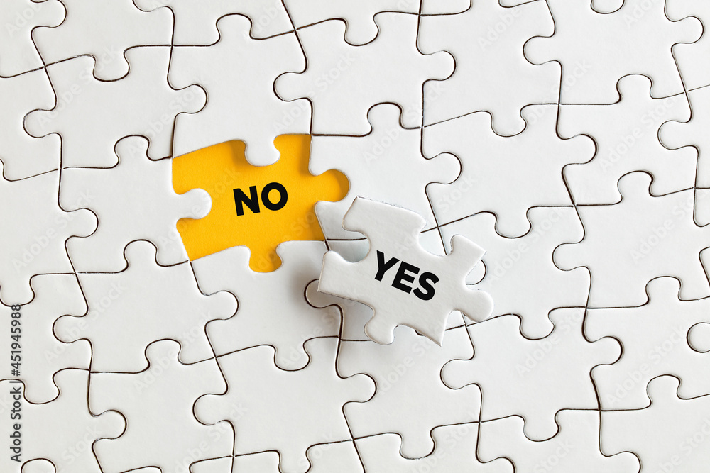 The words no and yes on the missing puzzle pieces. To learn to say no The words no and yes on the missing puzzle pieces. To learn to say no