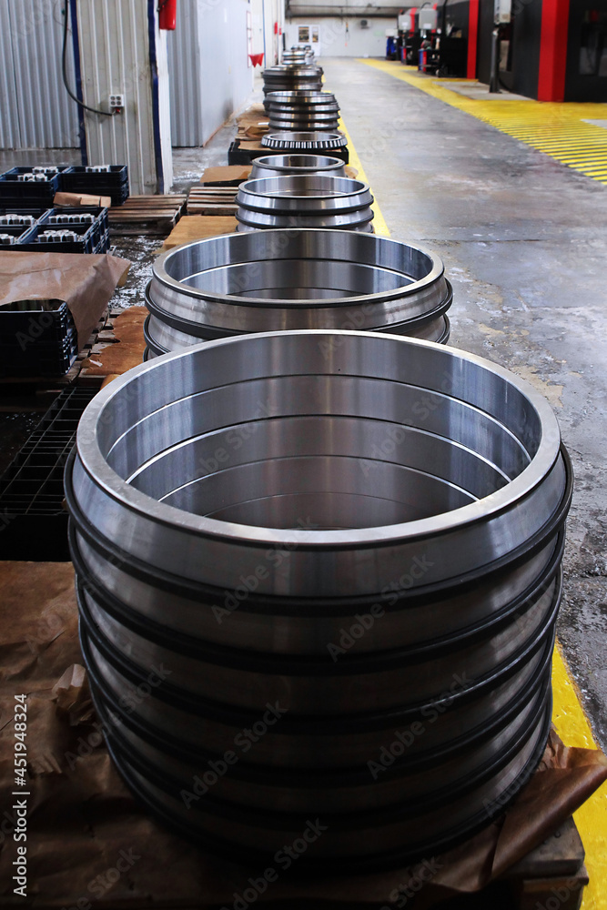 Large diameter bearings. Finished products of the bearing plant. Heavy industry concept.View from above. Vertical photo. Large diameter bearings. Finished products of the bearing plant. Heavy industry concept.View from above. Vertical photo.