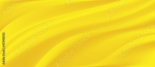 The luxury of light yellow fabric texture background.Closeup of rippled yellow silk fabric.Abstract cloth or liquid wave vector background.Cloth soft wave. Creases of satin, silk, and cotton.