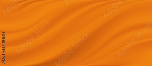 The luxury of orange fabric texture background.Closeup of rippled orange silk fabric.Abstract cloth or liquid wave vector background.Cloth soft wave. Creases of satin, silk, and cotton.