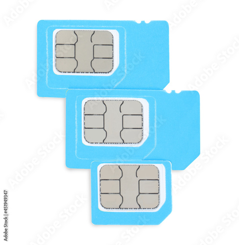 Light blue SIM cards on white background, top view photo