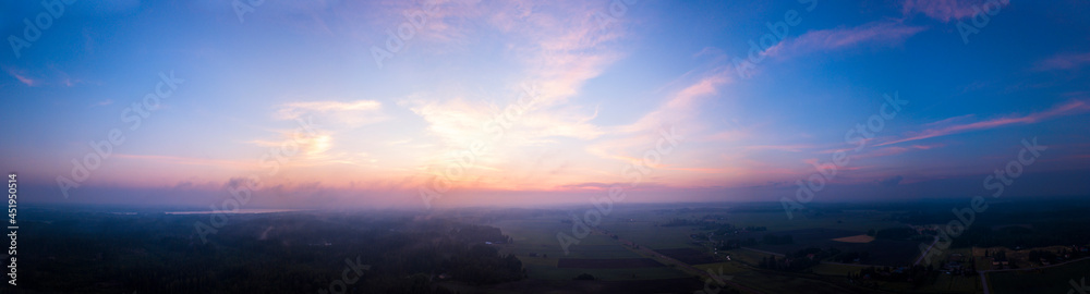 Foggy sunset over the fields in the countryside
