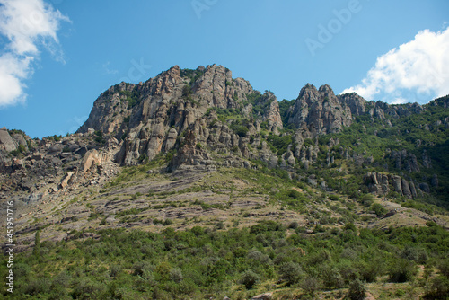 Beautiful sunny landscape of Demerdzhi rocky mountain and green forest