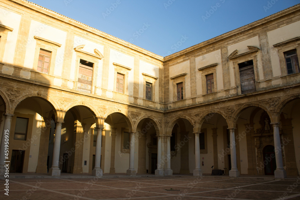 Mazara del Vallo, Sicily, Italy, January 19, 2020 evocative image of the main 
courtyard of the baroque palace of the Jesuit College