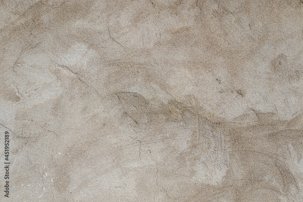 Obraz premium Cracked cement plastered wall as abstract background.