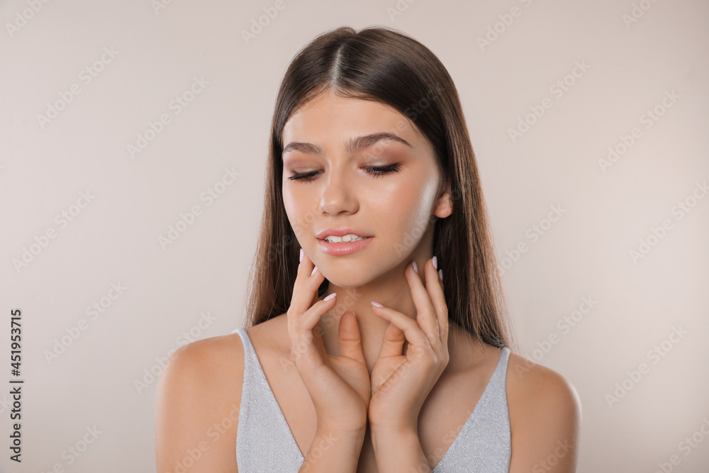 Portrait of pretty girl on light background. Beautiful face with perfect smooth skin Portrait of pretty girl on light background. Beautiful face with perfect smooth skin