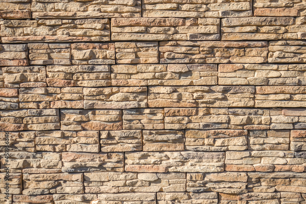 Artificial stone wall as a background. Artificial stone wall as a background.