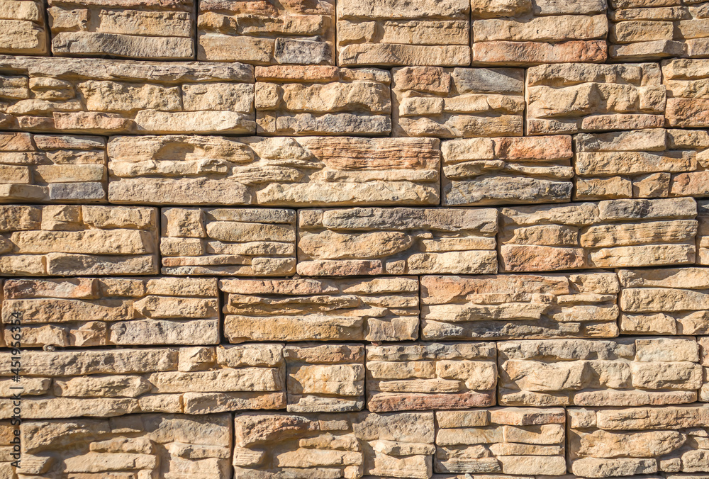 Artificial stone wall as a background. Artificial stone wall as a background.