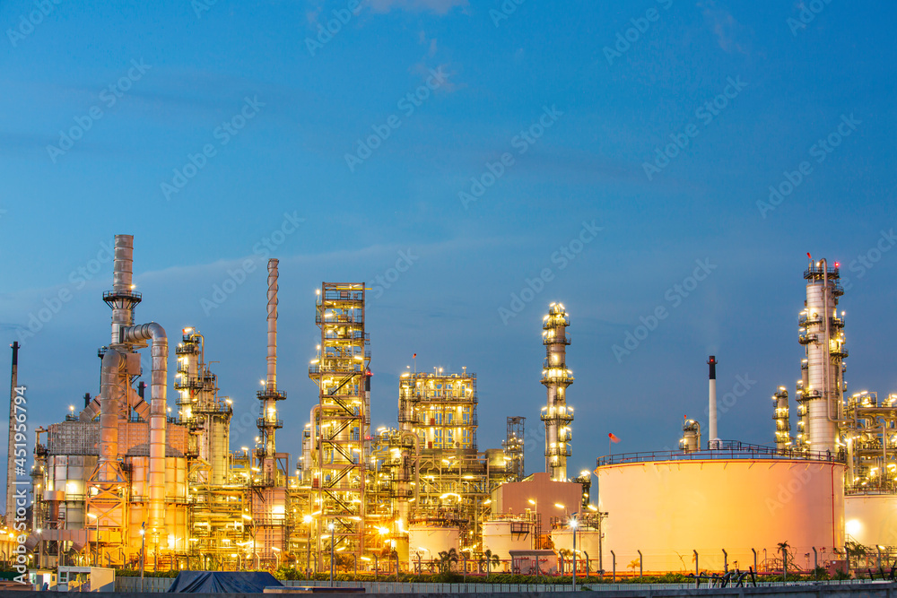 Twilight scene of oil refinery plant and storage white tank oil of Petrochemistry Twilight scene of oil refinery plant and storage white tank oil of Petrochemistry