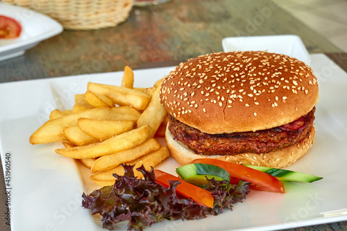 Hamburger with fries and salad