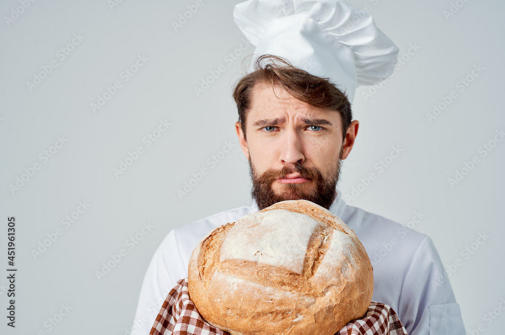 bearded man chef with bread in hand isolated background bearded man chef with bread in hand isolated background