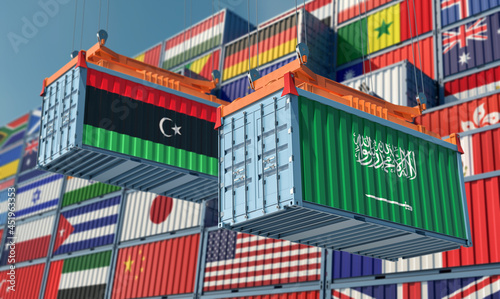 Freight containers with Saudi Arabia and Libya national flags. 3D Rendering © Marius Faust