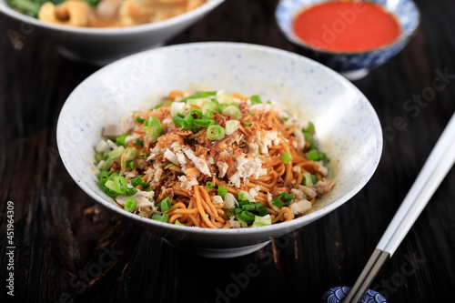 Mie Ayam, Indonesian Popular Street Food with Noodle, Chicken, and Green Vegetables with Delicious Broth
