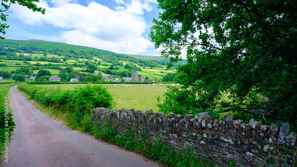 Obraz premium Waterfall and ford on the country lane near Pennant below Gospel Pass and Lord Hereford's Knob, near Hay-on-Wye, Wales