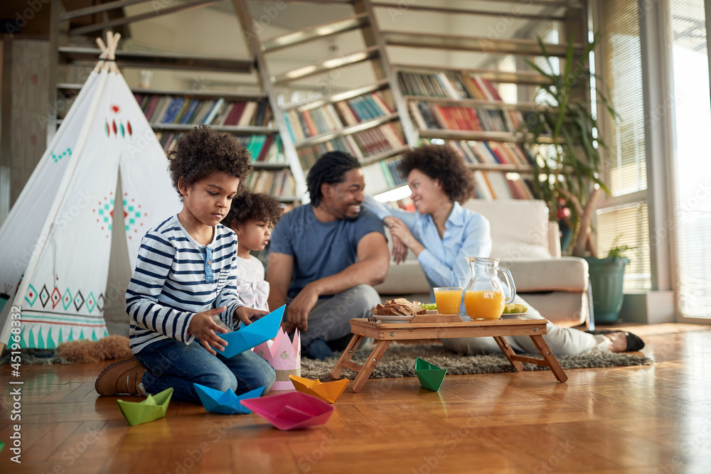 Fototapeta premium Happy afro american family spending weekend together