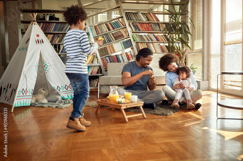 Lovely afro american family spending weekend together