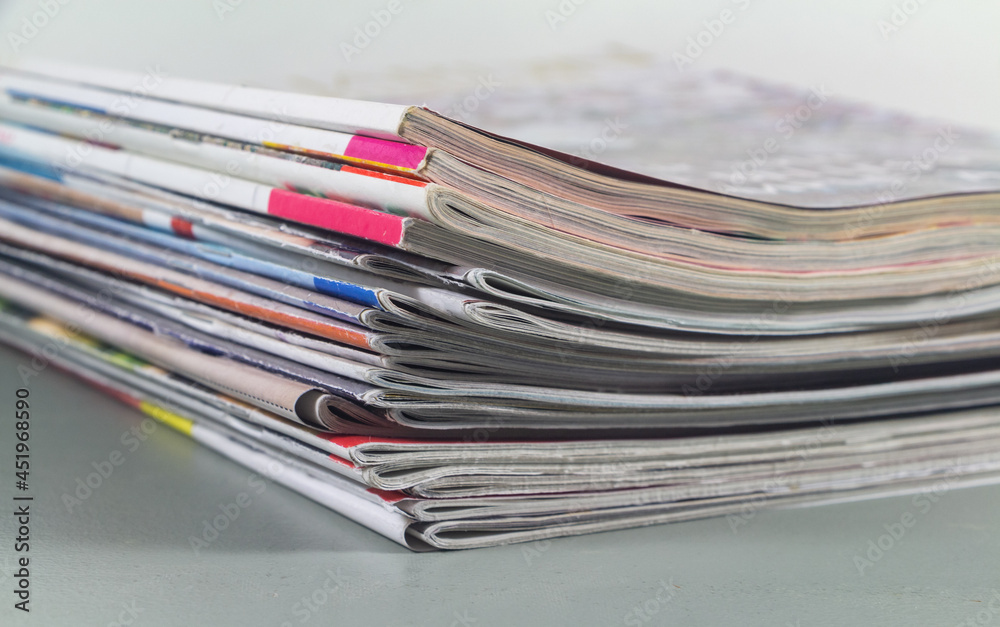 Pile of french magazine on a table Pile of french magazine on a table