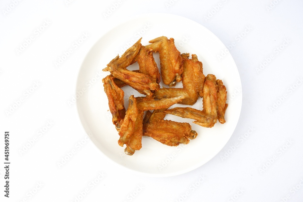 delicious fried chicken wings on white plate on white background delicious fried chicken wings on white plate on white background