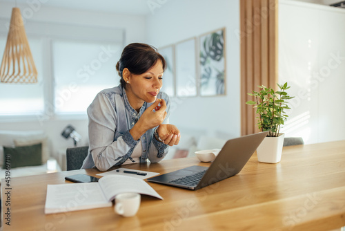 Beautiful woman working at home.