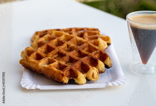 Belgian sugar waffles with black coffee served outdoor