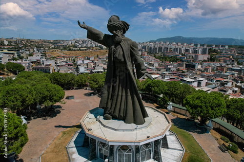 Buca, Turkey - August 14, 2021 : This statue was erected on Tingirtepe hill in Buca district of Izmir. As Mevlana, 