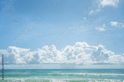 Beautiful wave soft blue breaking empty beach.Amazing wave on clean sandy surfing  beach.Landscape wave pattern sunset on summer.