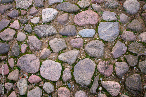 Hewn cobble stone pavement texture