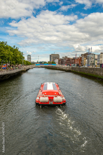 Tourist trip through the liffey river through the center of Dublin in the Republic of Ireland